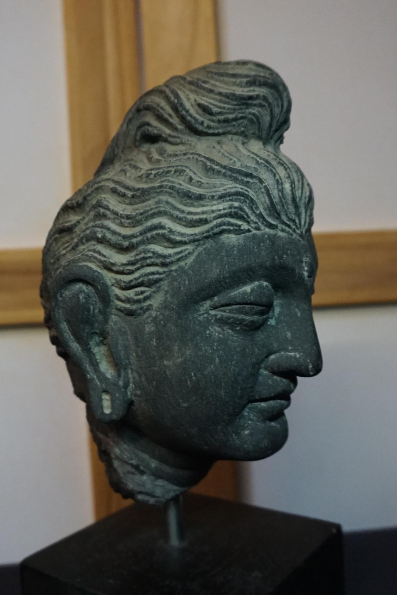 A gray schist head of Buddha GANDHARA, 2ND/3RD CENTURY