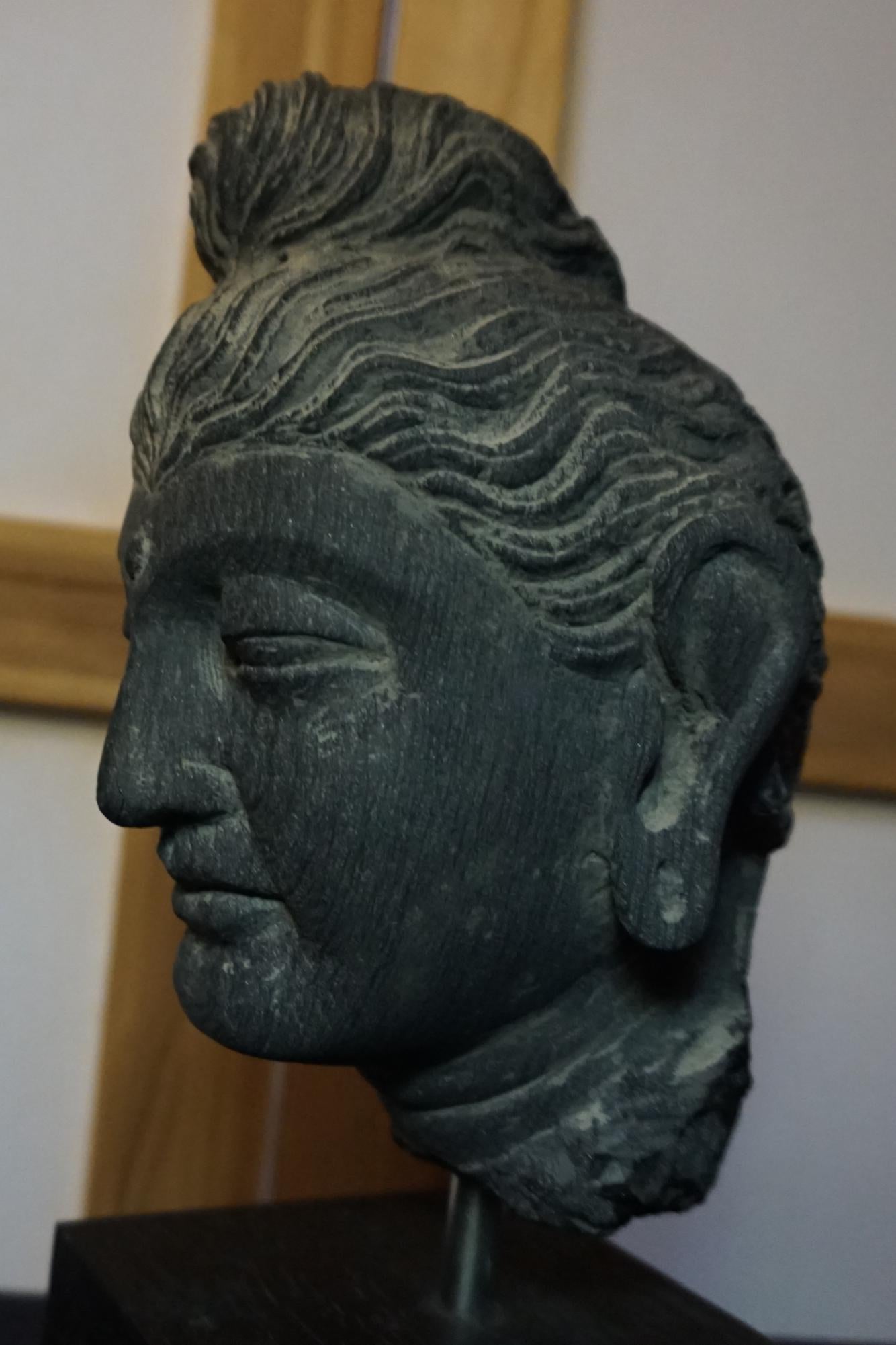 A gray schist head of Buddha GANDHARA, 2ND/3RD CENTURY